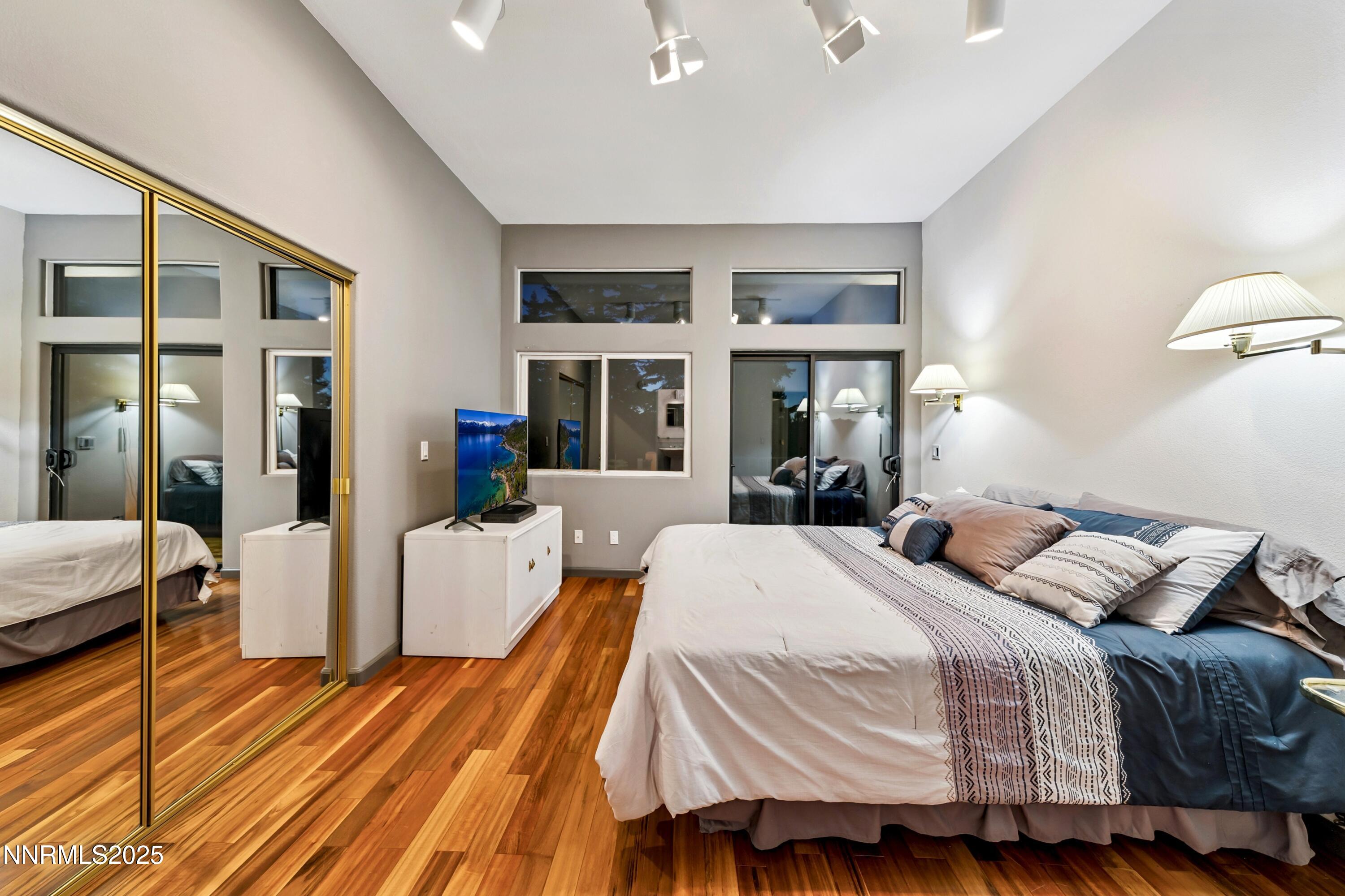 130 Granite Crest Drive Stateline, NV 89449 - Photo 70 of 85 a bedroom with a bed and wooden floor