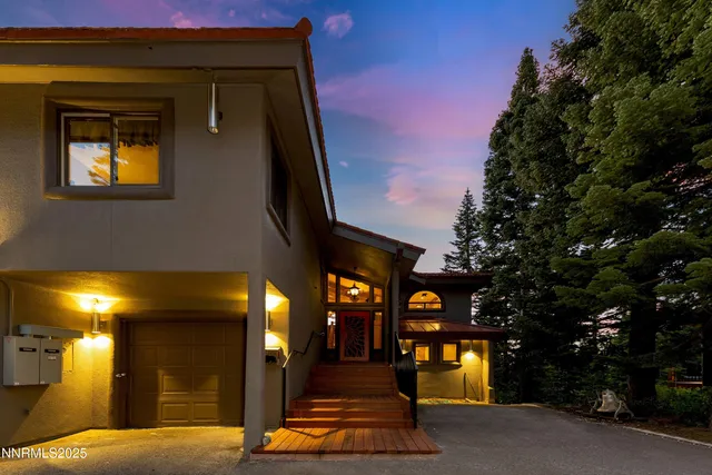 a living room with fireplace furniture and a flat screen tv