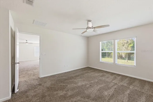 a view of a bathroom with wooden floor