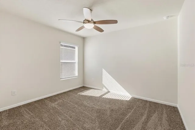 a view of a house with outdoor space and palm tree