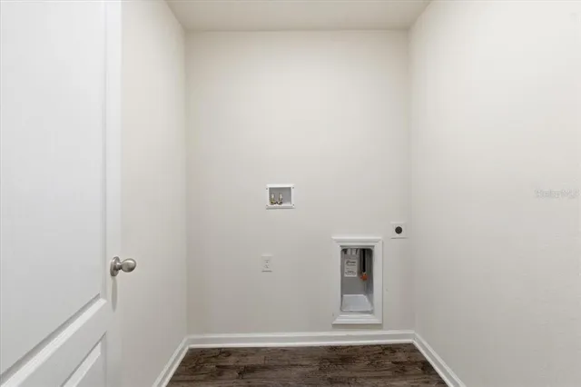 an aerial view of a house with a yard and potted plants