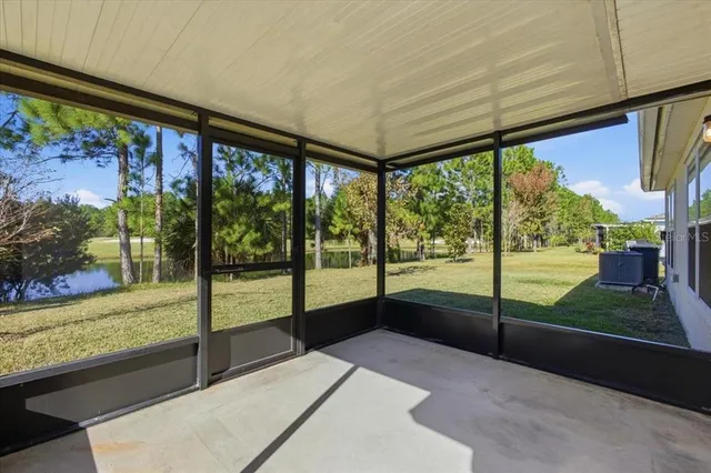 an aerial view of a residential houses with outdoor space and parking