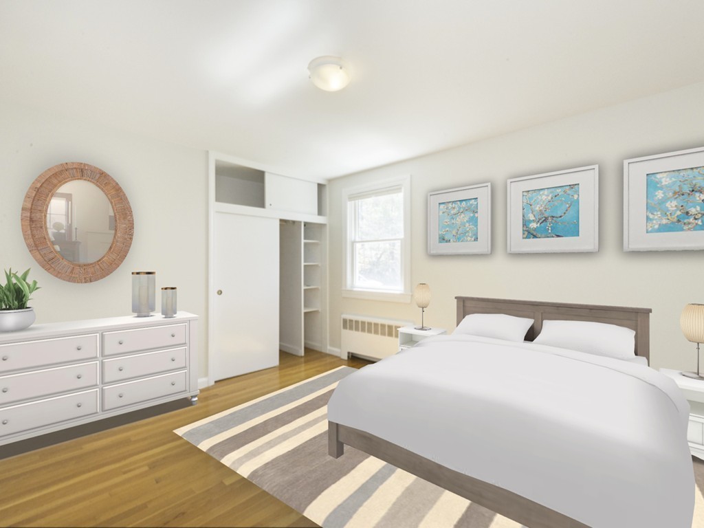 14 Russell Road Lexington, MA 02420 - Photo 12 of 20 a bedroom with a large bed and a mirror