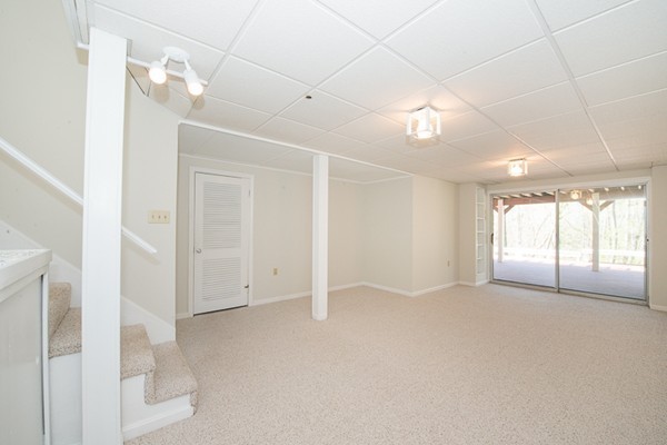 14 Russell Road Lexington, MA 02420 - Photo 14 of 20 en empty room with windows and entrance