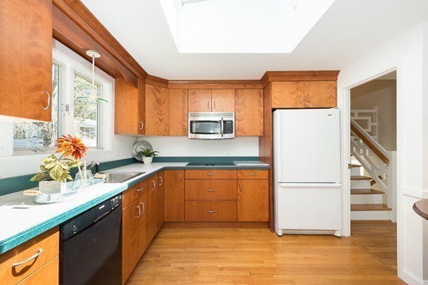 14 Russell Road Lexington, MA 02420 - Photo 8 of 20 a kitchen with a refrigerator and a sink