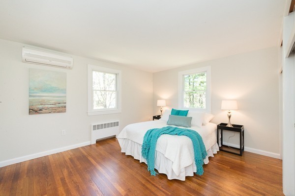 14 Russell Road Lexington, MA 02420 - Photo 10 of 20 a bedroom with a bed and wooden floor