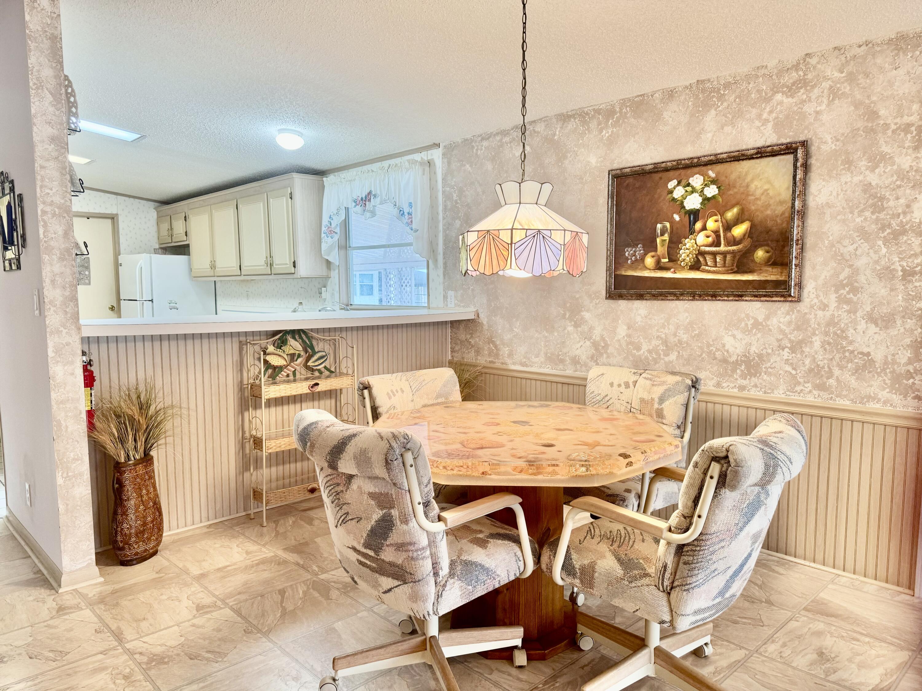 1704 Southwest 35th Circle Okeechobee, FL 34974 - Photo 19 of 44 a view of a dining room with furniture