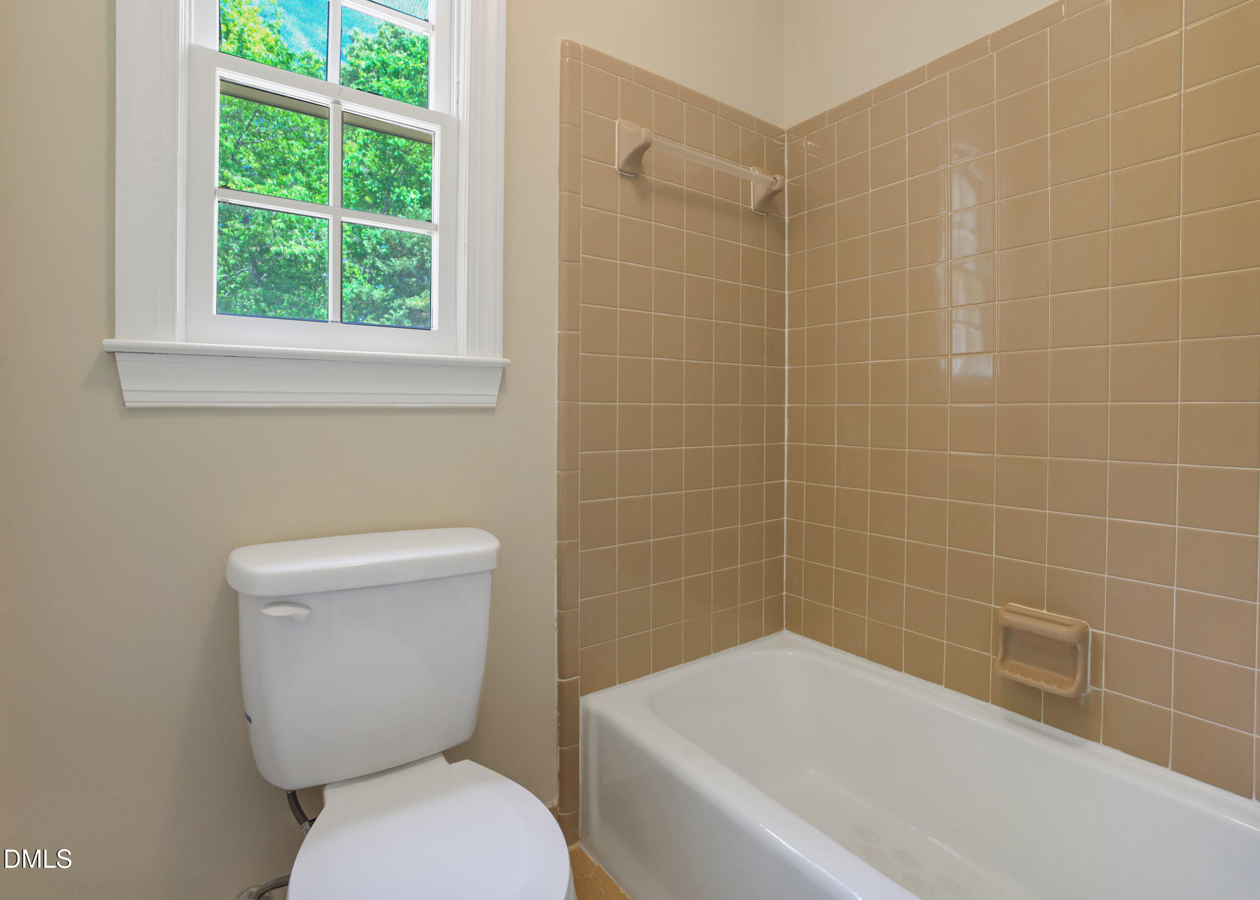 5018 Dunwoody Trail Raleigh, NC 27606 - Photo 19 of 24 a white toilet sitting next to a bath tub