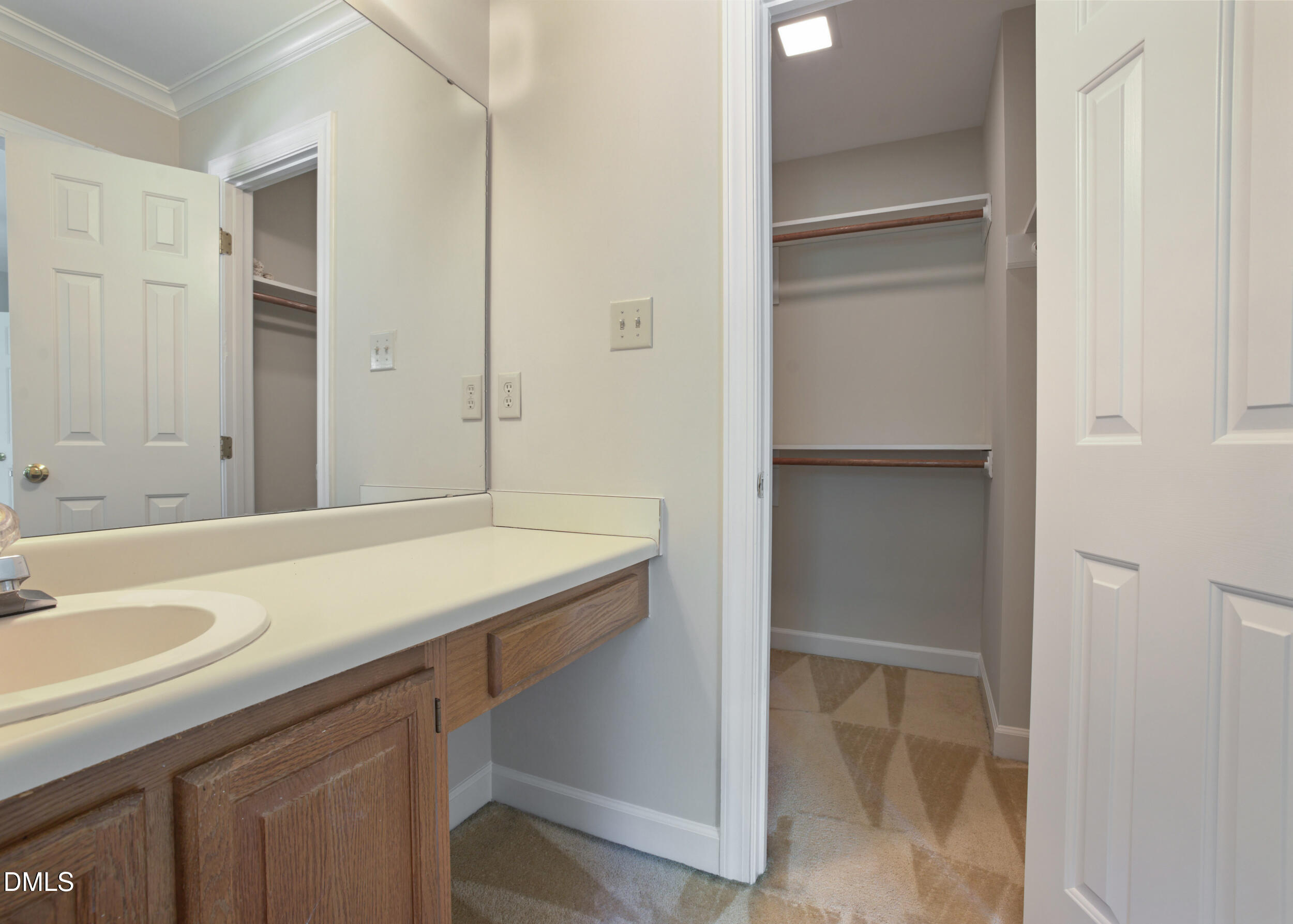5018 Dunwoody Trail Raleigh, NC 27606 - Photo 20 of 24 a bathroom with a sink and a mirror