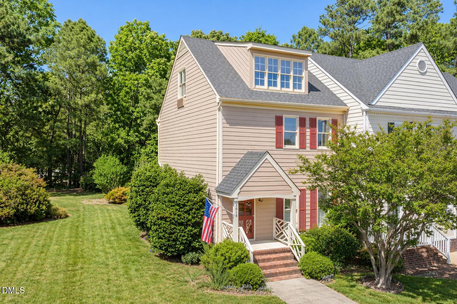 5018 Dunwoody Trail Raleigh, NC 27606 - Photo 2 of 24 a front view of a house with a garden and plants