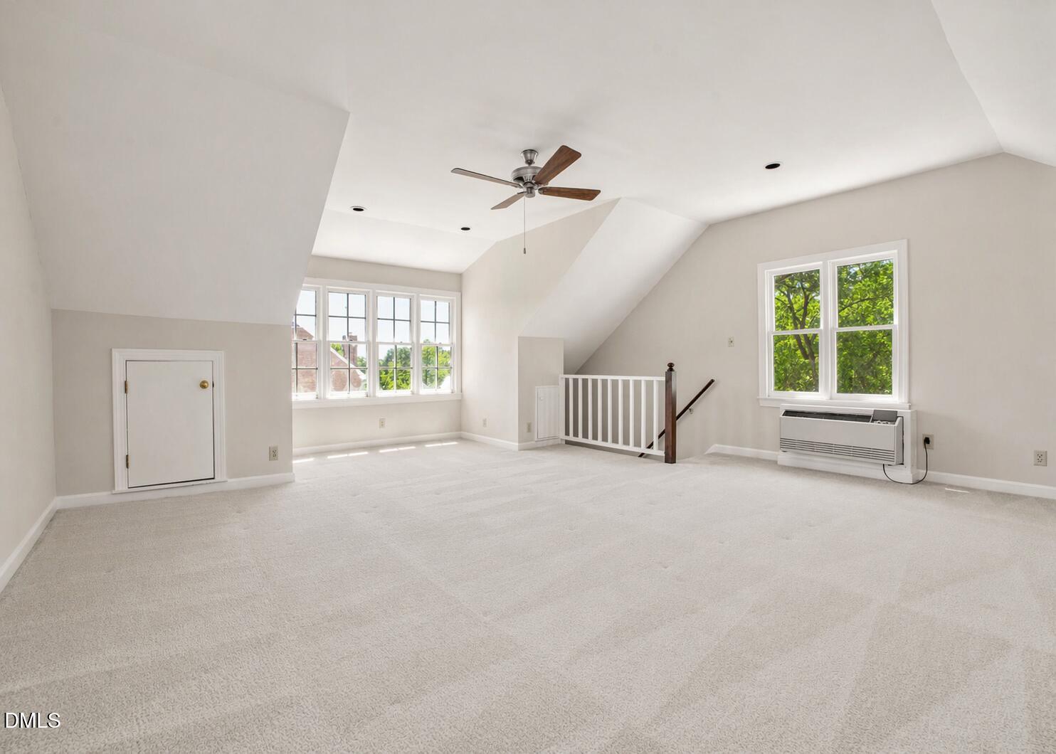 5018 Dunwoody Trail Raleigh, NC 27606 - Photo 22 of 24 an empty room with windows and ceiling fan