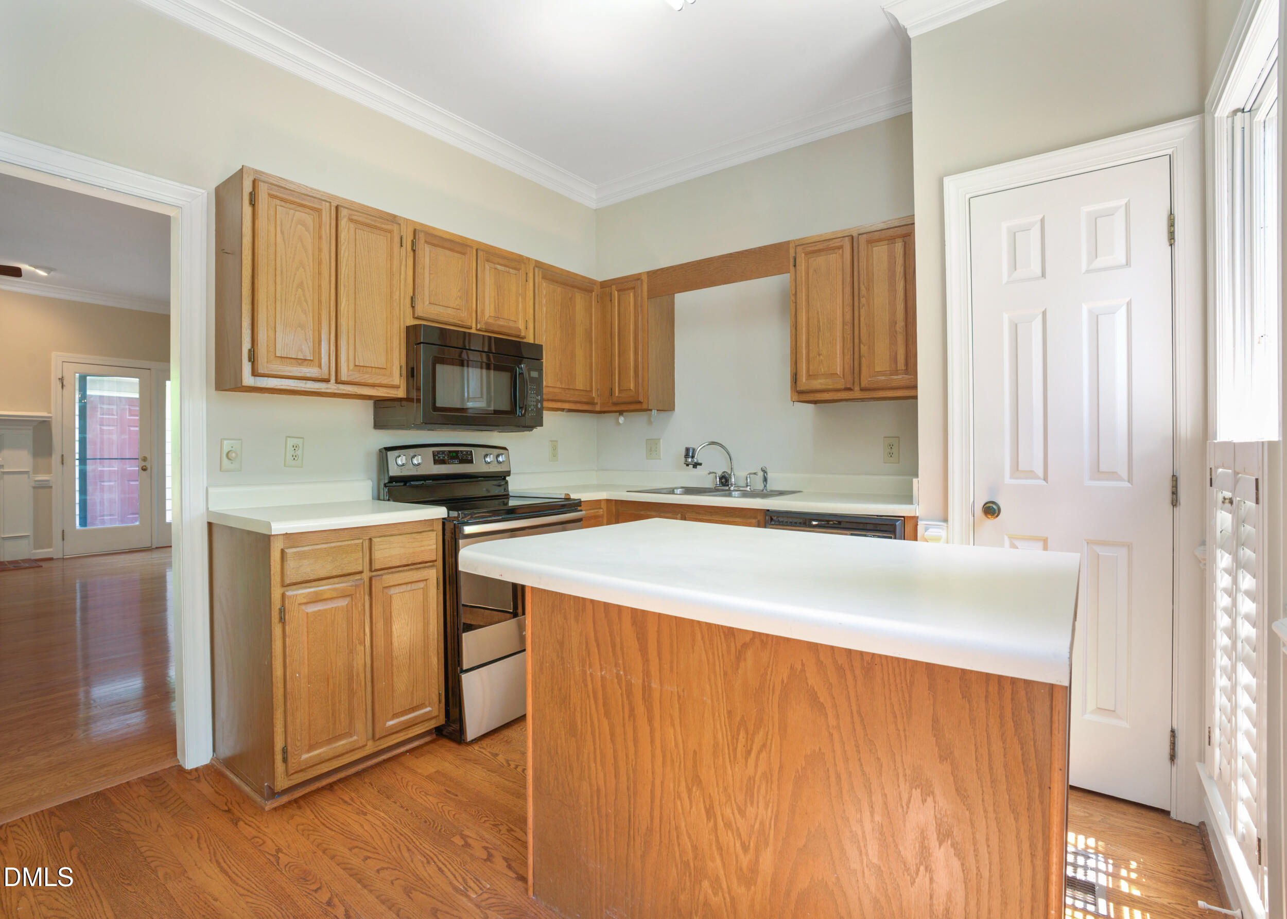 5018 Dunwoody Trail Raleigh, NC 27606 - Photo 6 of 24 a kitchen with stainless steel appliances granite countertop a stove a sink and a microwave