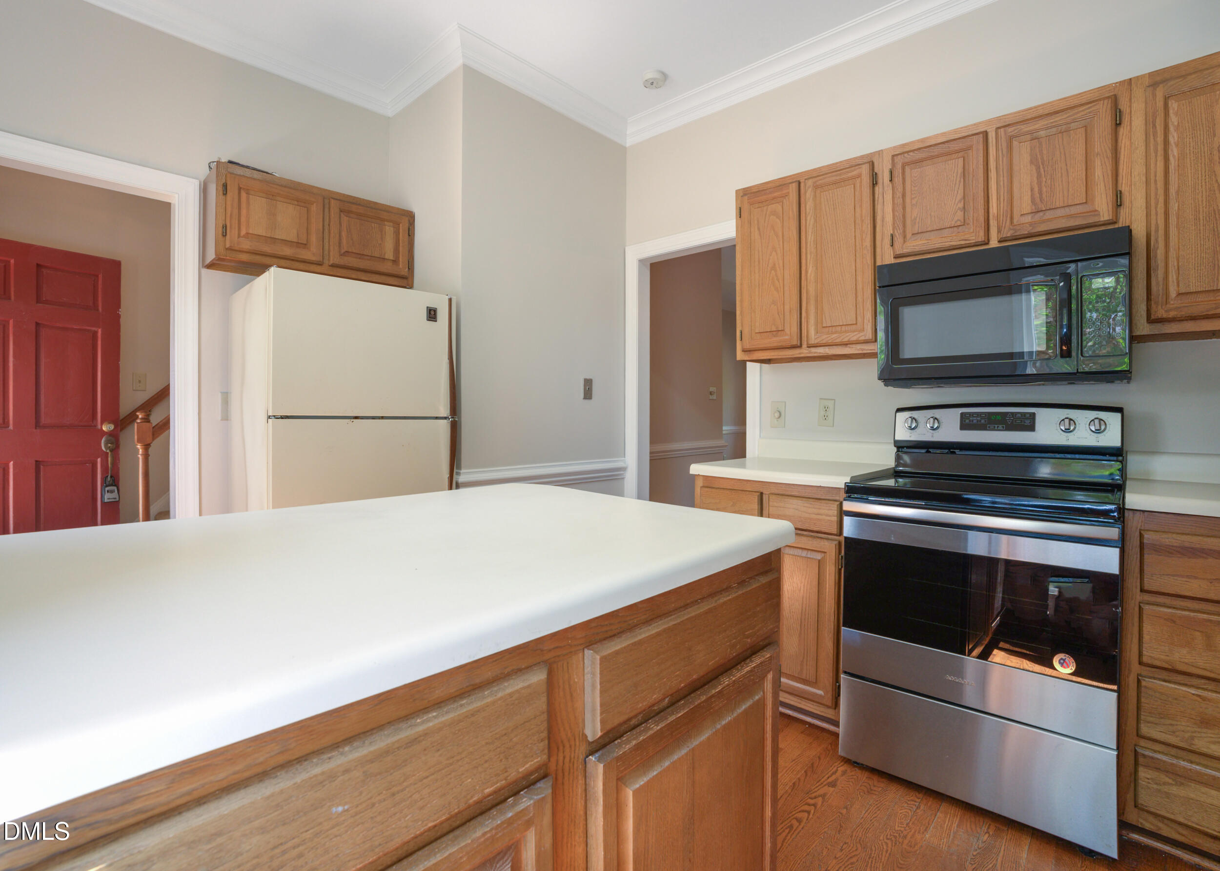 5018 Dunwoody Trail Raleigh, NC 27606 - Photo 7 of 24 a kitchen with granite countertop cabinets and steel stainless steel appliances