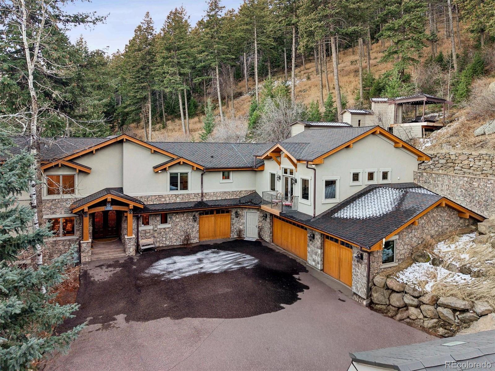 an aerial view of a house with swimming pool and furniture