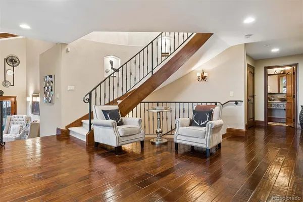 a view of a livingroom with furniture and bathroom