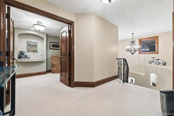a room with gym equipment and view of living room