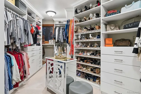 a spacious bathroom with a granite countertop tub sink shower and mirror