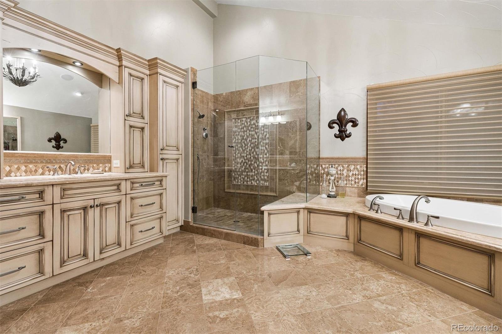45 West Ranch Trail Morrison, CO 80465 - Photo 35 of 50 a spacious bathroom with a granite countertop tub sink shower and mirror