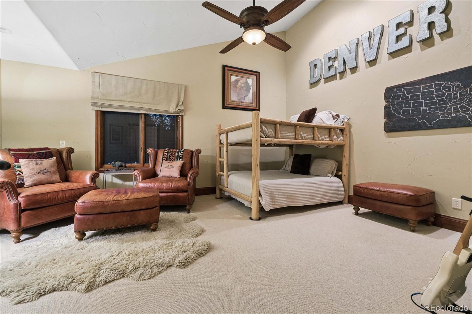 45 West Ranch Trail Morrison, CO 80465 - Photo 40 of 50 a bedroom with furniture and a couch
