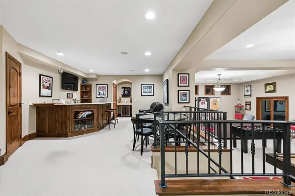 a living room with furniture a piano and a flat screen tv