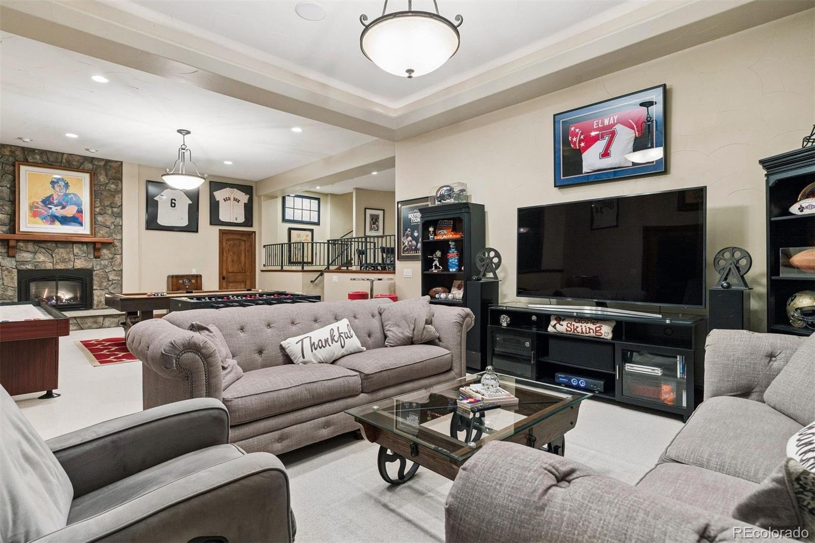 45 West Ranch Trail Morrison, CO 80465 - Photo 50 of 50 a living room with furniture and a flat screen tv