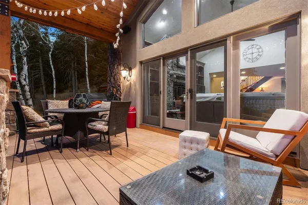 a outdoor space with patio furniture and wooden floor