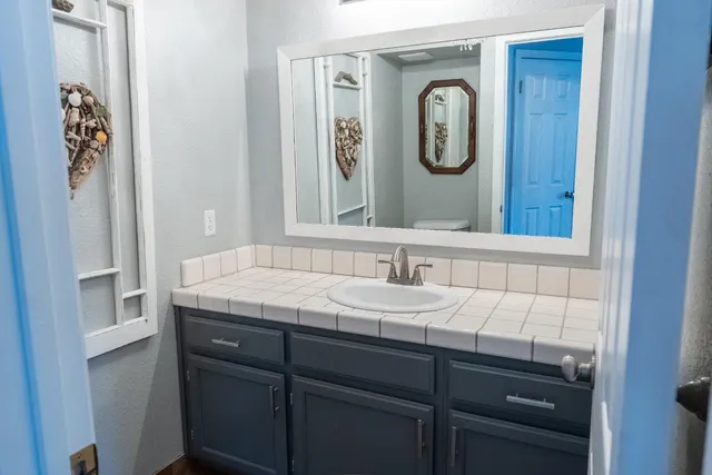 a view of entryway with wooden floor and fan