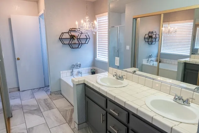 a kitchen with a sink and cabinets