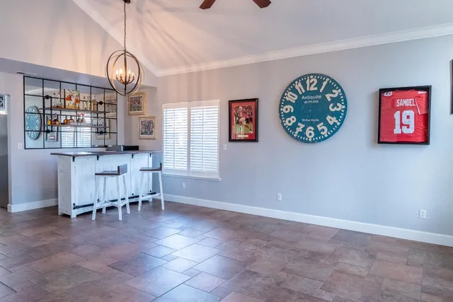 an empty room with furniture and windows