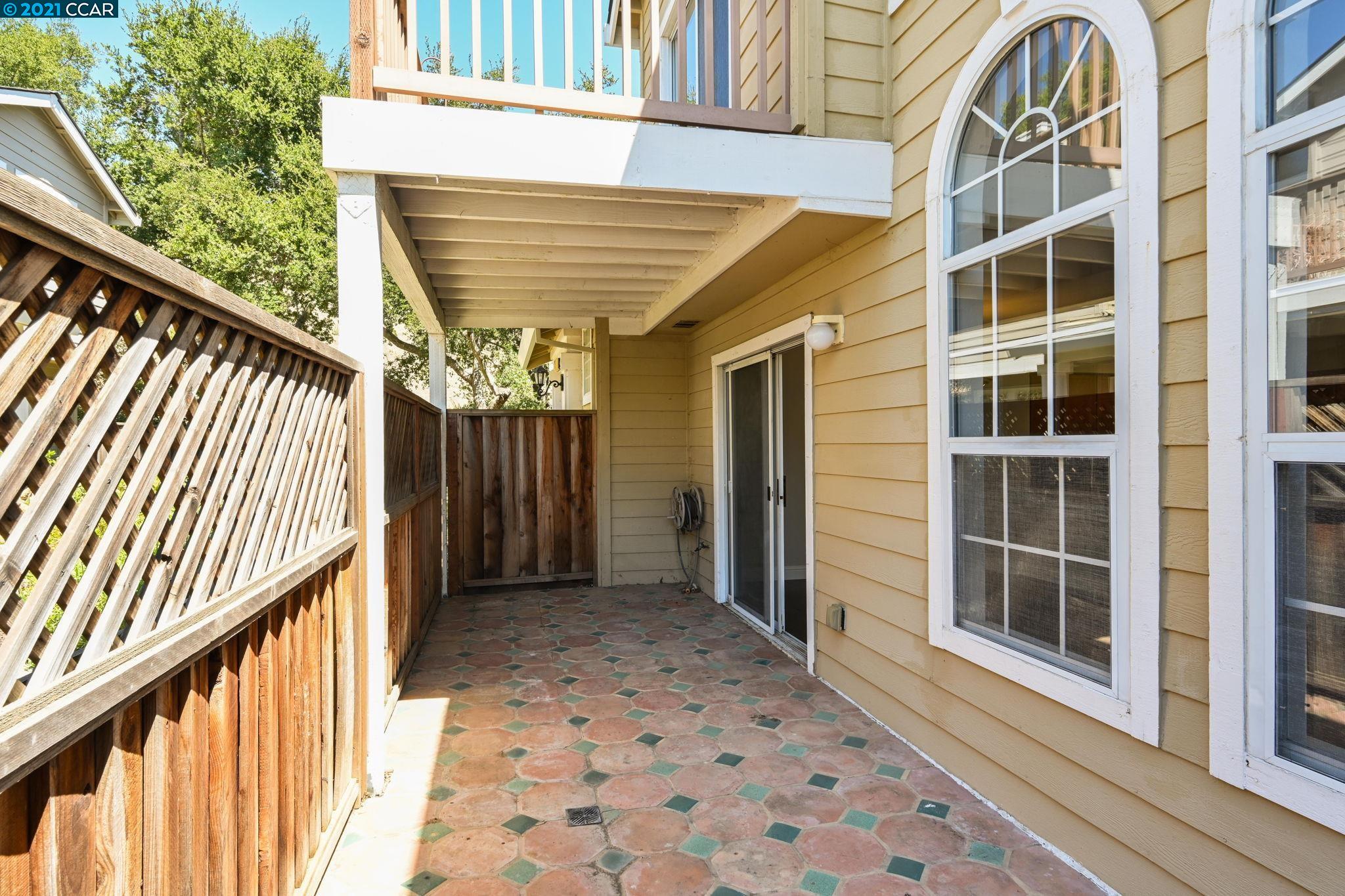 703 Destiny Lane San Ramon, CA 94583 - Photo 18 of 22 a view of a porch with wooden floor and iron stairs