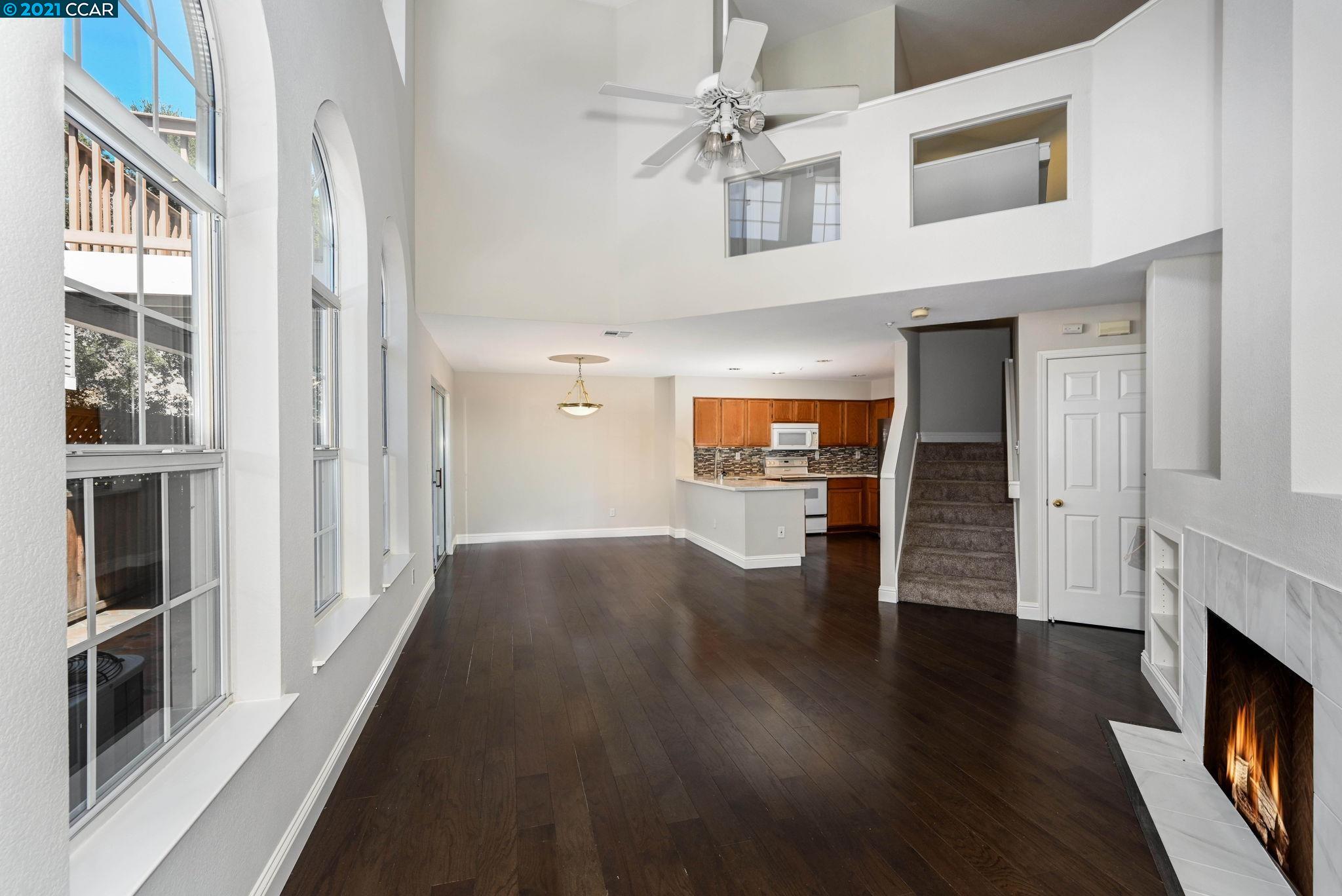703 Destiny Lane San Ramon, CA 94583 - Photo 3 of 22 wooden floor in an empty room with a fireplace