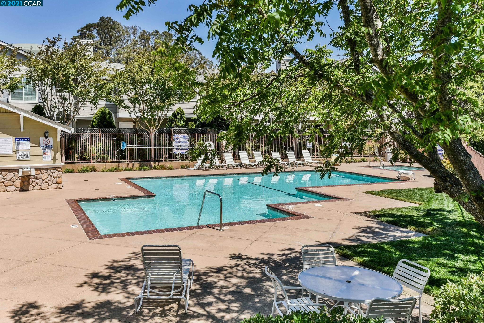 703 Destiny Lane San Ramon, CA 94583 - Photo 21 of 22 a view of a swimming pool with a patio and a yard