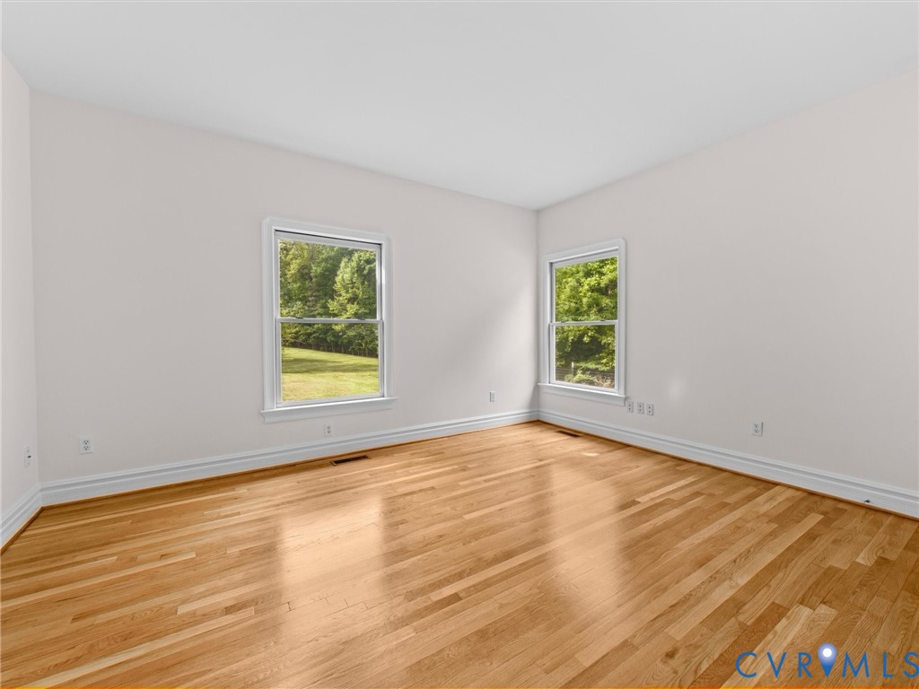 1700 Tigers Road Manakin-Sabot, VA 23103 - Photo 30 of 64 a view of an empty room with wooden floor and a window