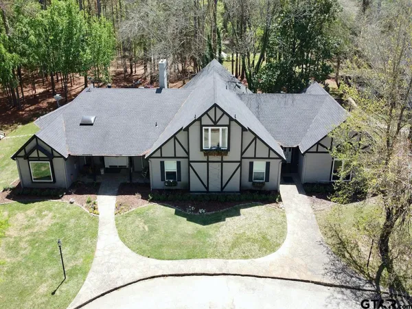 a view of a house with a yard balcony