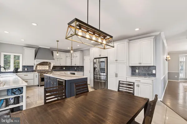 a kitchen with a stove sink and refrigerator