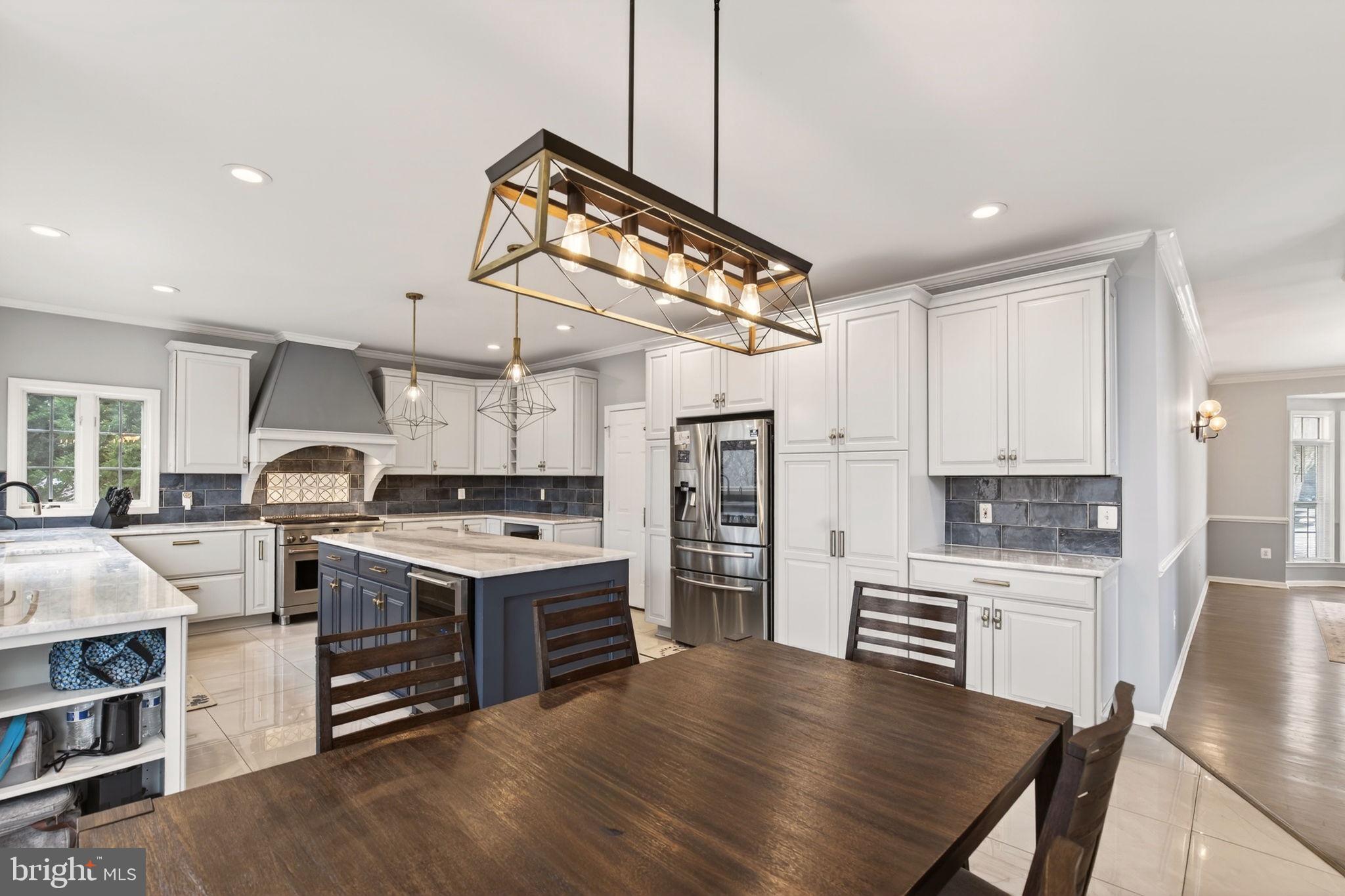 8020 Pohick Road Springfield, VA 22153 - Photo 15 of 57 a kitchen with cabinets and wooden floor