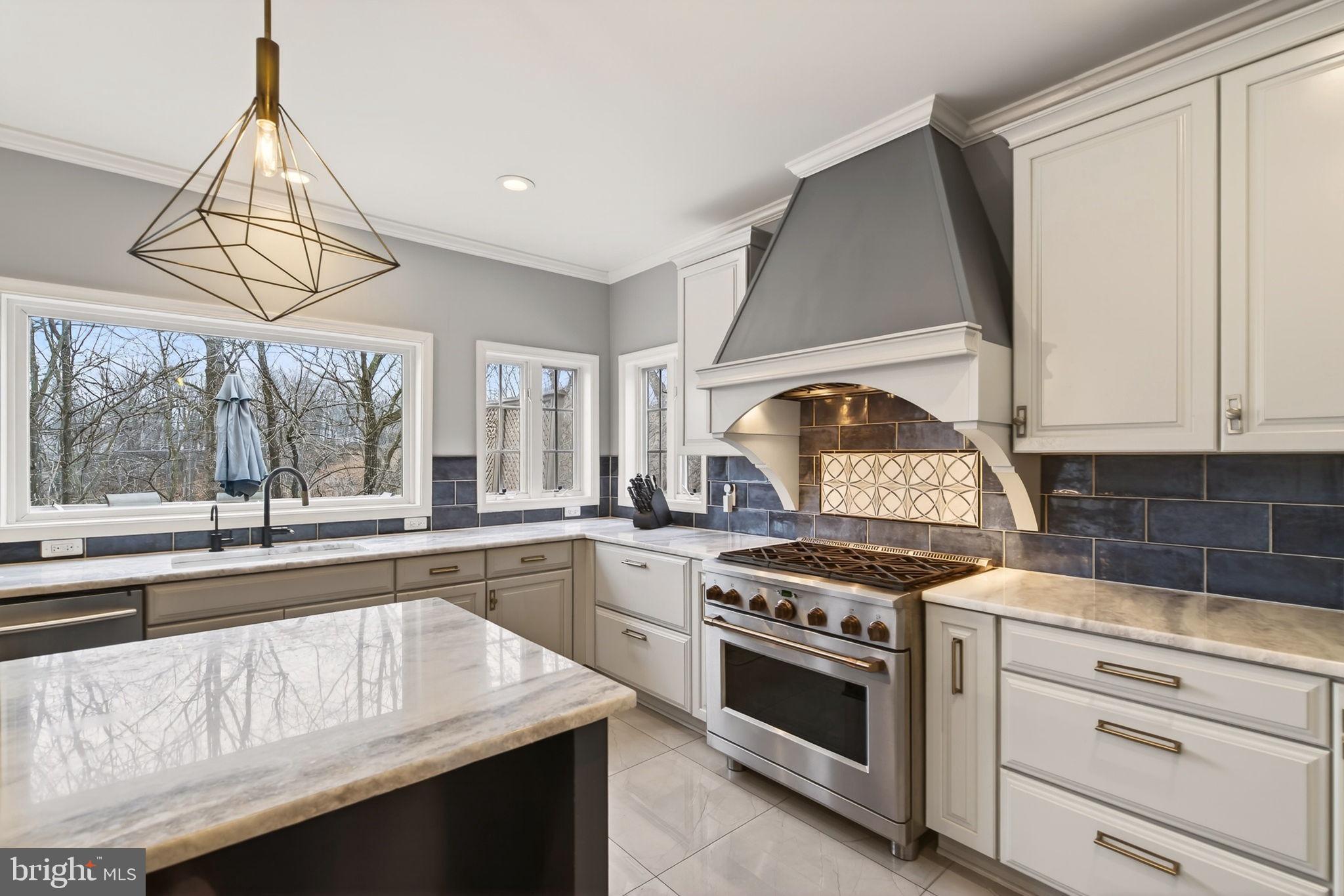 8020 Pohick Road Springfield, VA 22153 - Photo 17 of 57 a kitchen with a stove a sink and a window