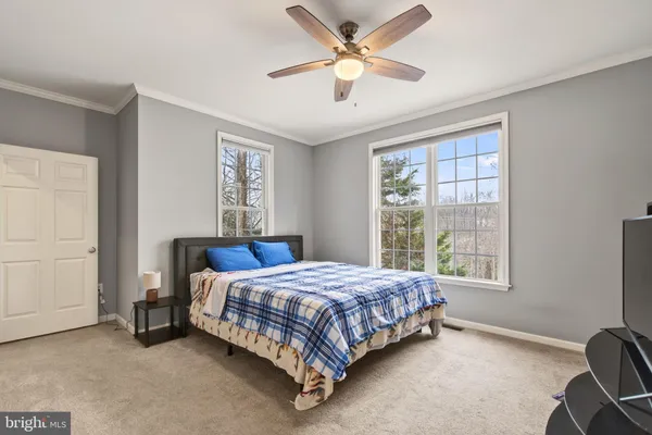 a bed room with a bed and a desk