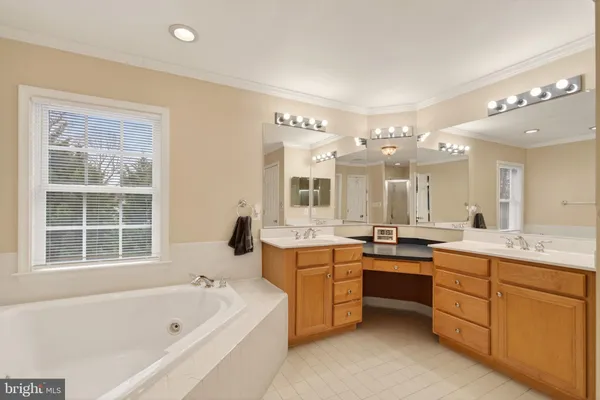 a en suite bathroom with a sink and mirror
