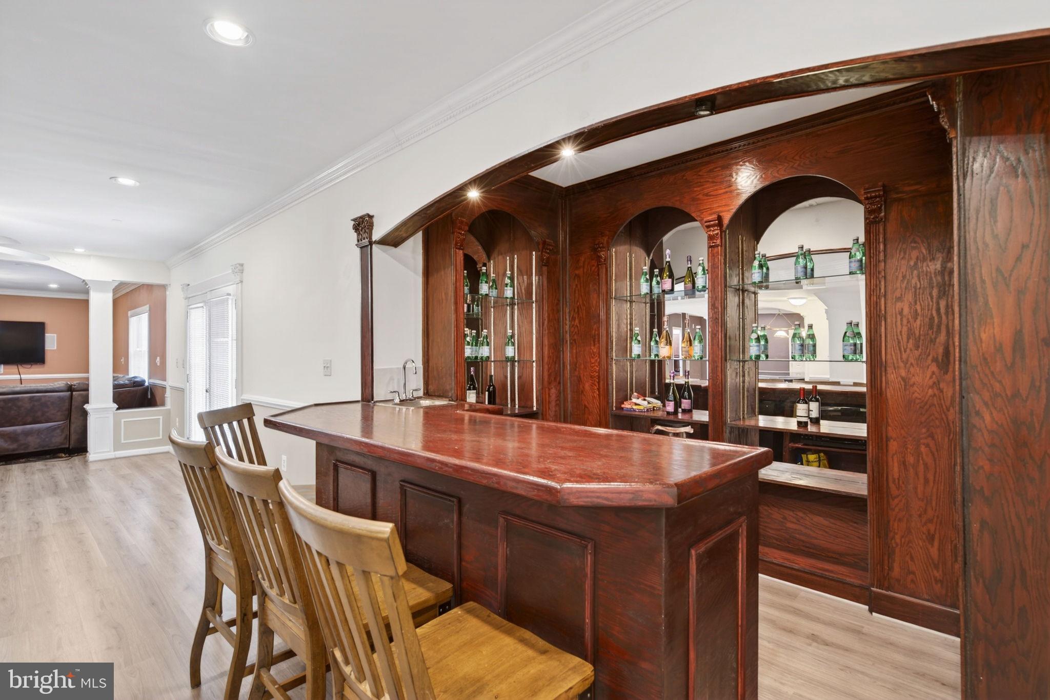 8020 Pohick Road Springfield, VA 22153 - Photo 37 of 57 a dining hall with stainless steel appliances granite countertop a couch and wooden floor
