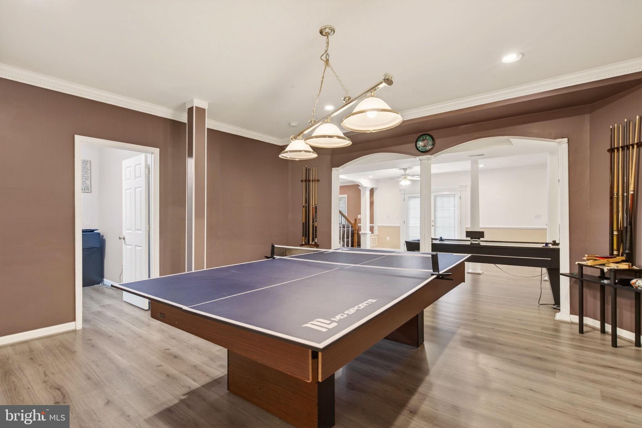 8020 Pohick Road Springfield, VA 22153 - Photo 40 of 57 a room with pool table and a chandelier