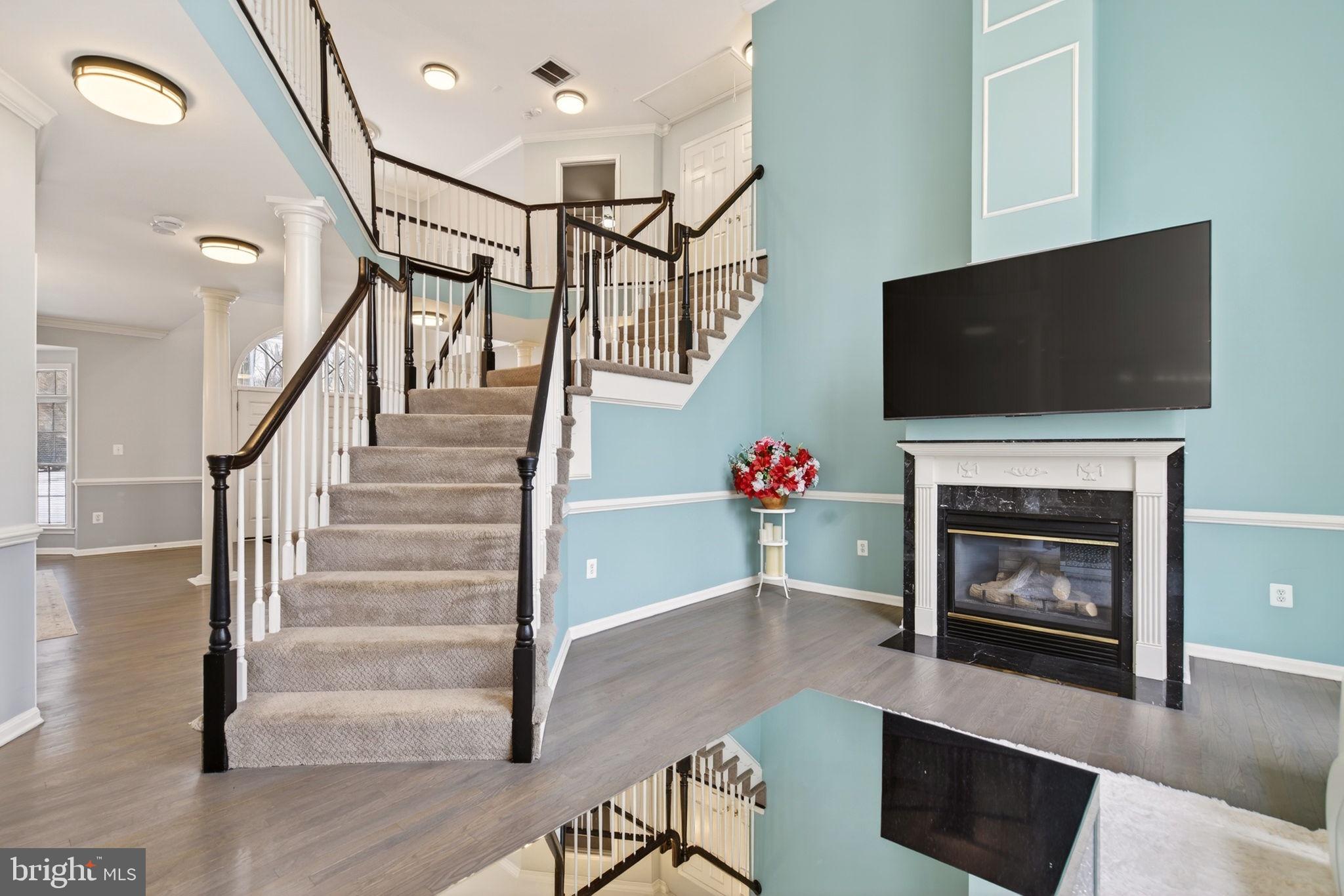 8020 Pohick Road Springfield, VA 22153 - Photo 46 of 57 a living room with furniture and a fireplace