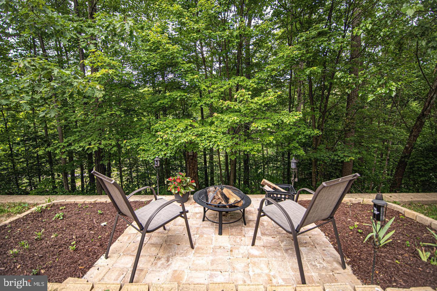 8020 Pohick Road Springfield, VA 22153 - Photo 56 of 57 a view of a chairs and tables in the backyard