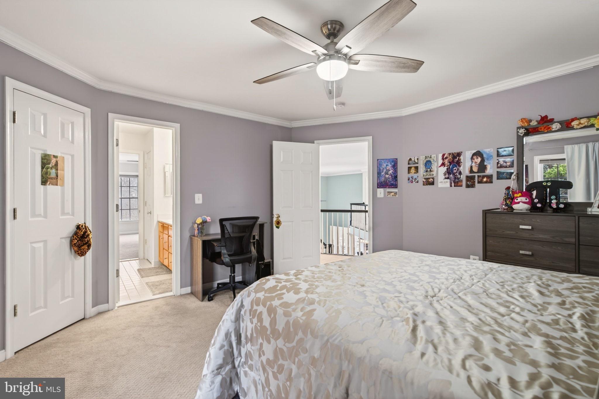 8020 Pohick Road Springfield, VA 22153 - Photo 57 of 57 a bedroom with a bed and a chandelier