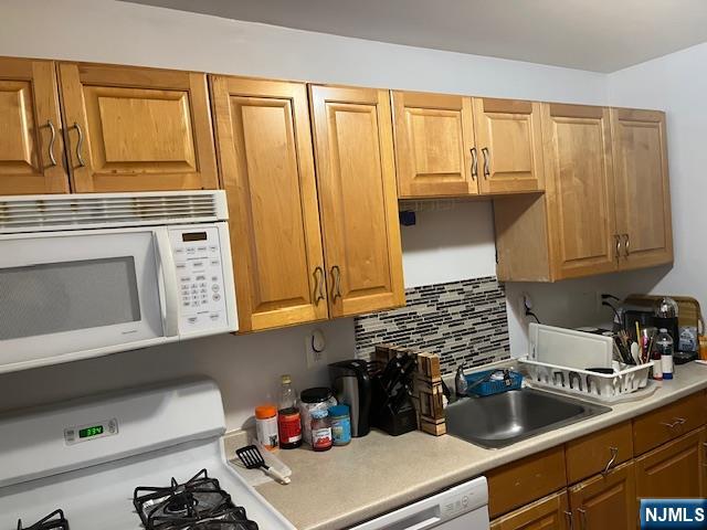 2330 Linwood Avenue, Unit 4F Fort Lee, NJ 07024 - Photo 12 of 13 a kitchen with a sink and cabinets