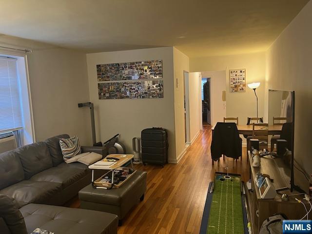 2330 Linwood Avenue, Unit 4F Fort Lee, NJ 07024 - Photo 5 of 13 a living room with furniture and a flat screen tv