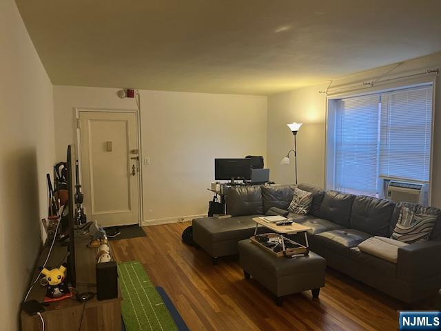 2330 Linwood Avenue, Unit 4F Fort Lee, NJ 07024 - Photo 6 of 13 a living room with furniture and a flat screen tv