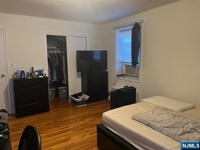 2330 Linwood Avenue, Unit 4F Fort Lee, NJ 07024 - Photo 7 of 13 a bedroom with a bed and a dresser