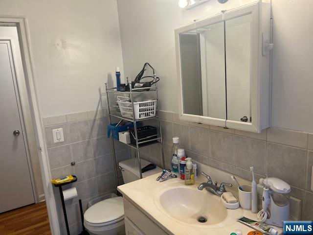 2330 Linwood Avenue, Unit 4F Fort Lee, NJ 07024 - Photo 9 of 13 a bathroom with a sink a toilet and shower