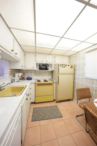 a bathroom with a sink and a window